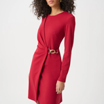 Woman wearing a red dress with a gold belt on a white background