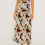 Woman wearing a floral brown pattern dress on a white background