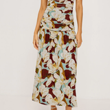 Woman wearing a floral brown pattern dress on a white background
