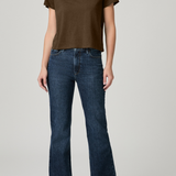Person wearing a brown t-shirt and blue jeans on a plain background
