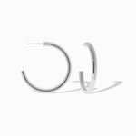 silver hoops on white background 