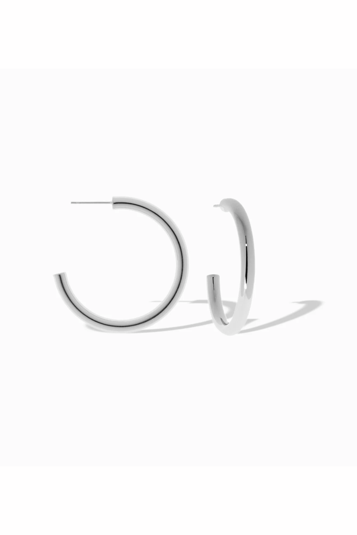 silver hoops on white background 