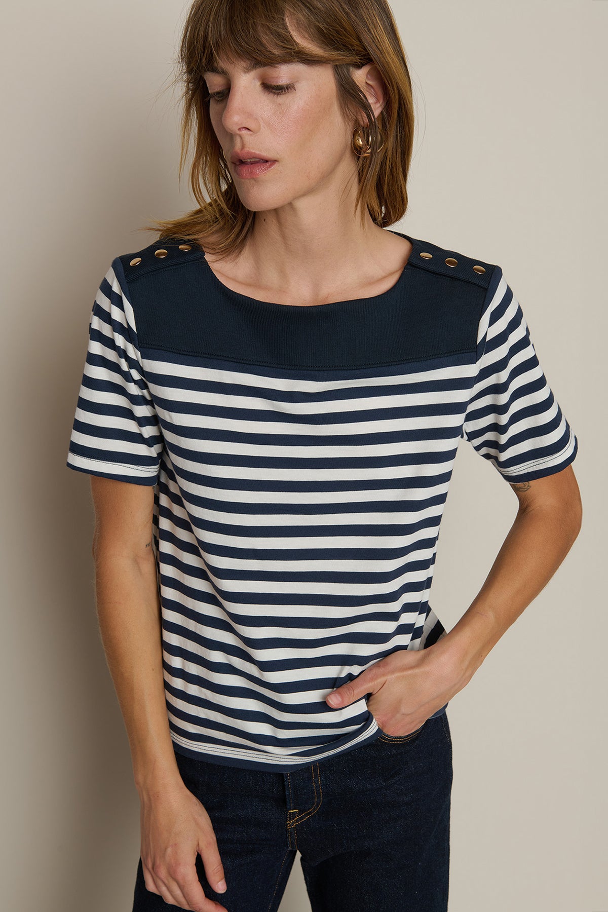 Striped short-sleeve tee with a relaxed fit, styled with denim