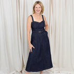 Indigo midi dress with a sweetheart neckline, corset-inspired seams, and a belted waist