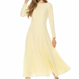 woman in butter yellow midi dress and long sleeves on white background 