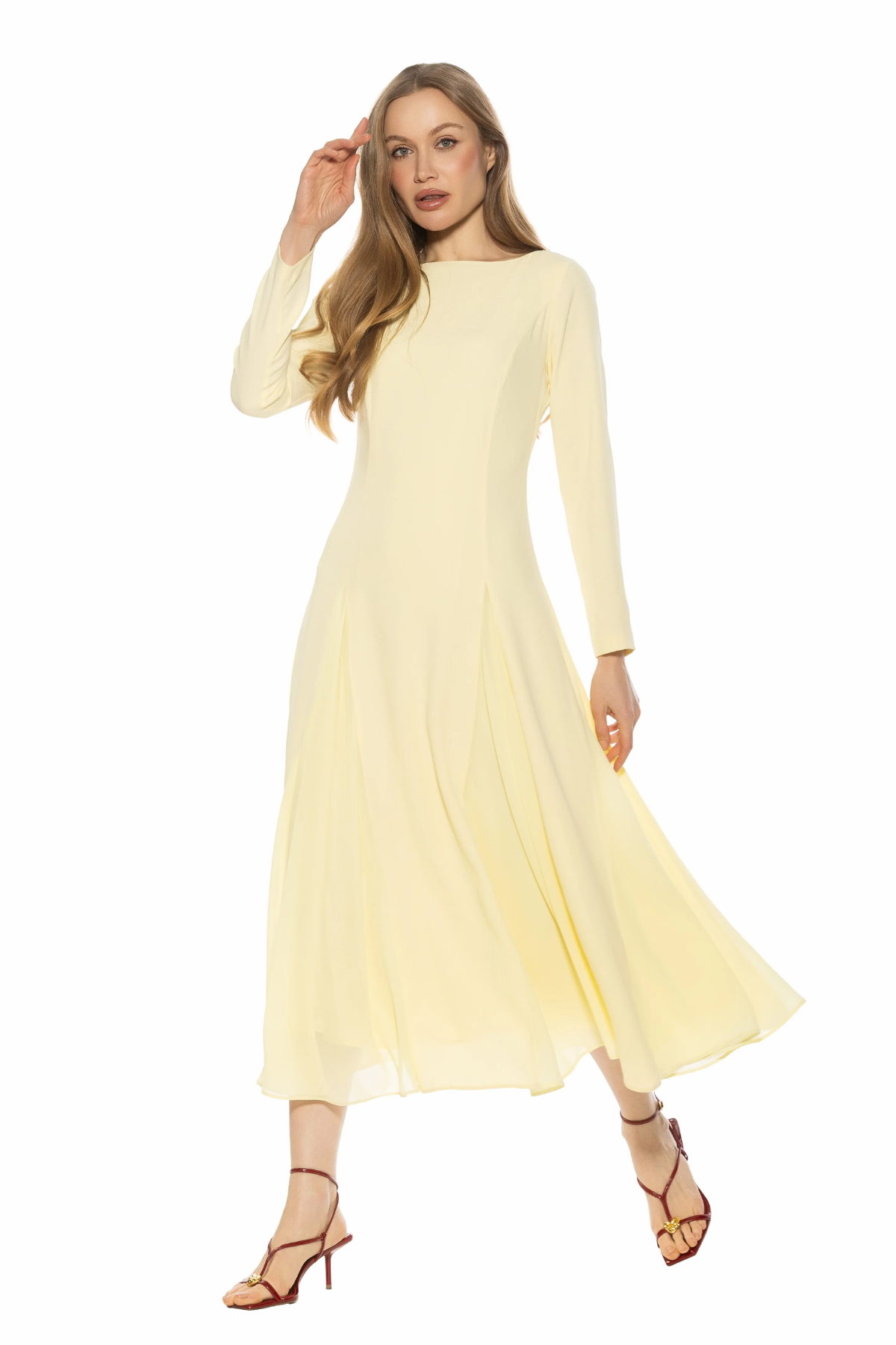 woman in butter yellow midi dress and long sleeves on white background 
