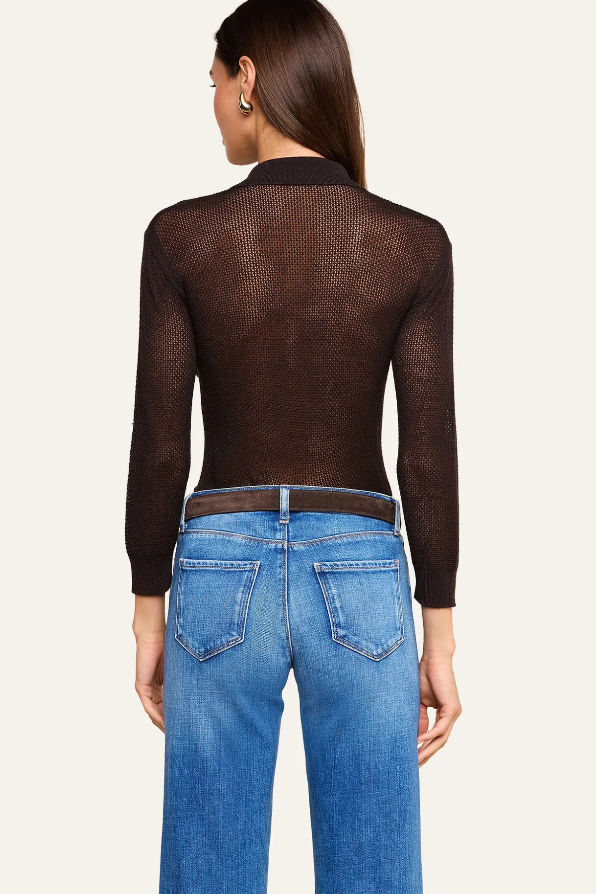 Women's blue pointelle knit sweater featuring a collared neckline and long sleeves.