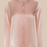 Pink sheer blouse with a solid background