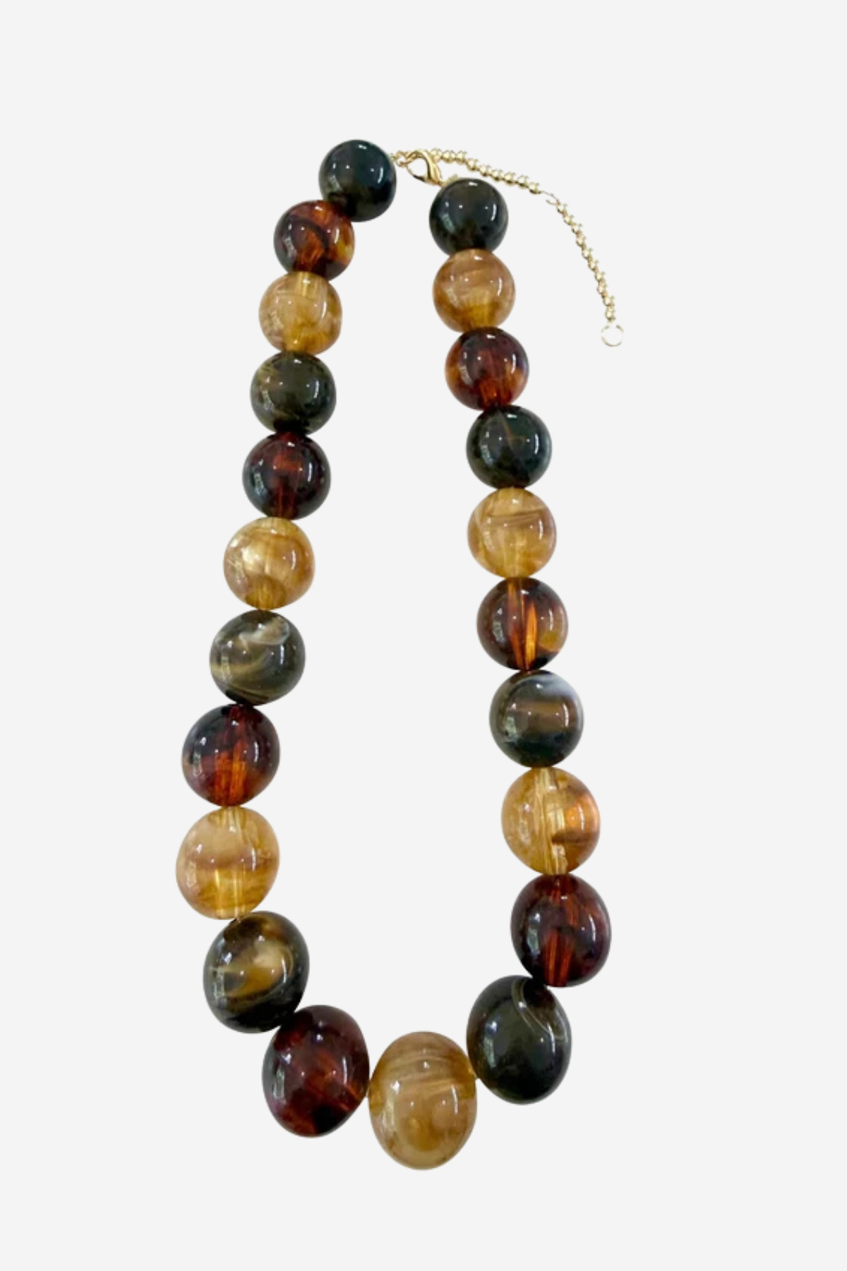 A beaded necklace made of polished round stone beads in earthy brown, amber, green, and black tones, with a small gold chain extender, shown on a light gray background.