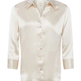 champagne silk blouse on white background 